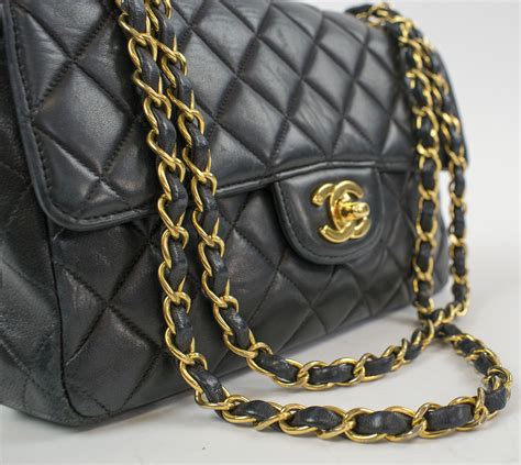 do chanel handbags always have leather through the chain|history of chanel's handbags.